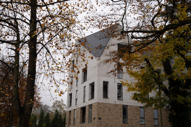 Foxley Lane apartments seen through the established trees.