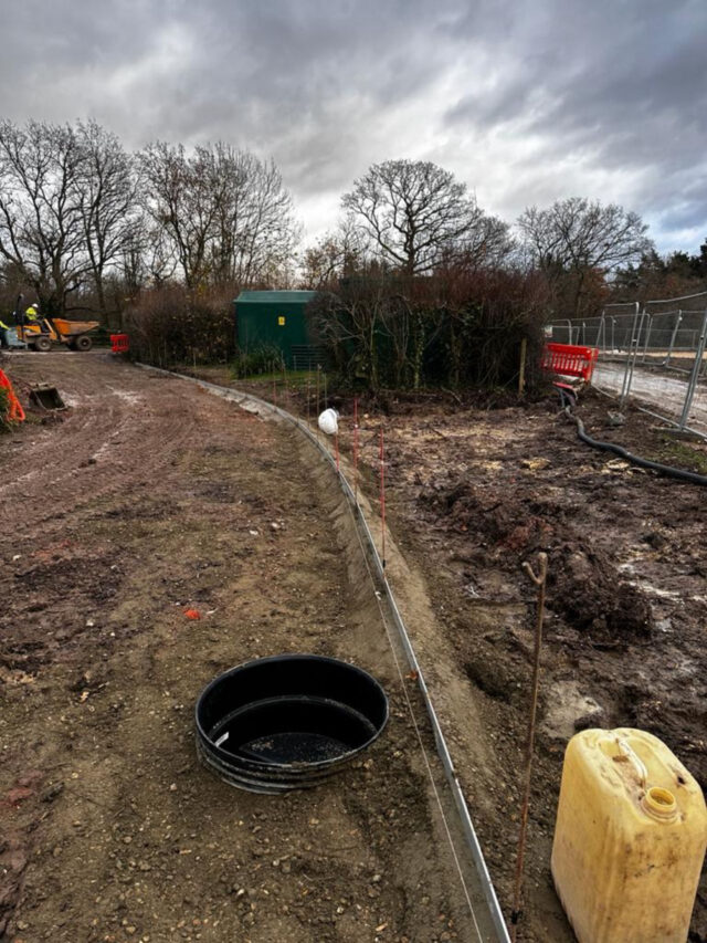 Aluminium edging follows the path during construction at Itchen Valley Country Park.