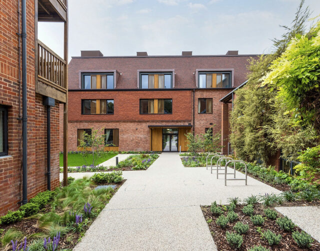 Path through planted borders leading to the new building at Lucy Cavendish College.