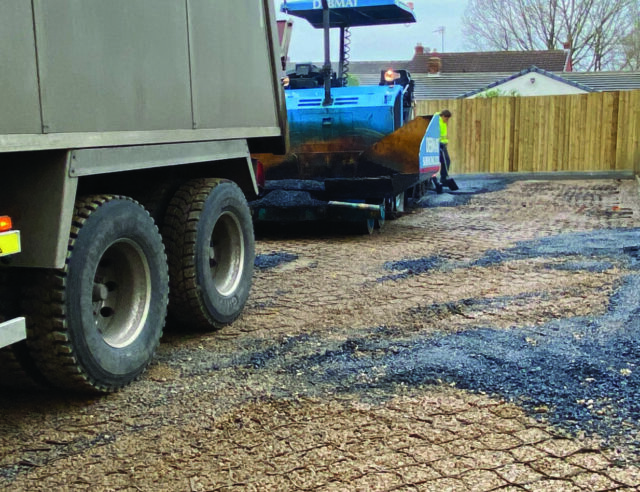 Construction vehicle over the cellular reinforcement during installation at The Grange.