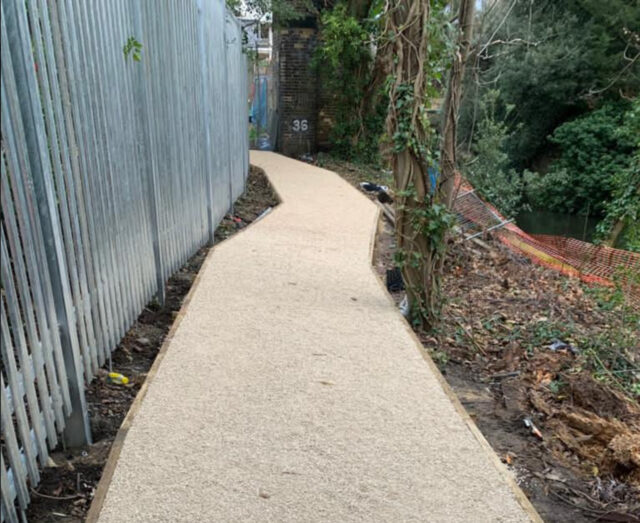 Finished gravel path beside trees at Twickenham Gateway.